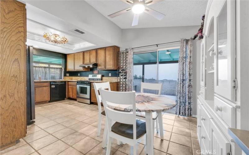 Dining area off kitchen with ceiling fan