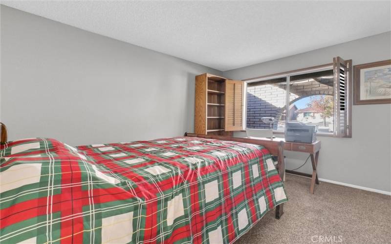 Bedroom 2 with wood shutters