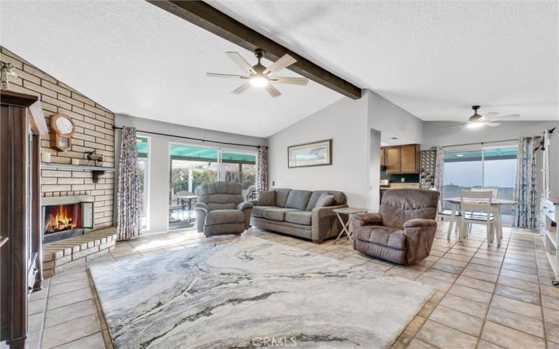 Living room with ceiling fan and slider to back patio