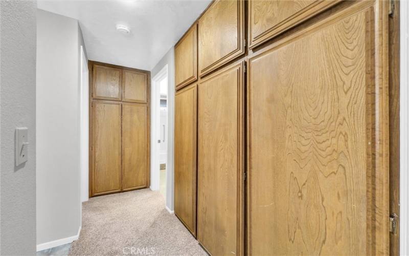 Lots of cabinets for storage near hall bath.