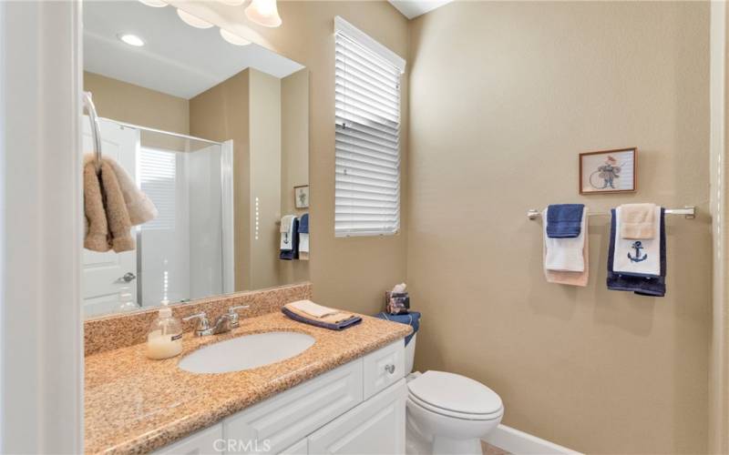 Guest bedroom with private bathroom stand in shower