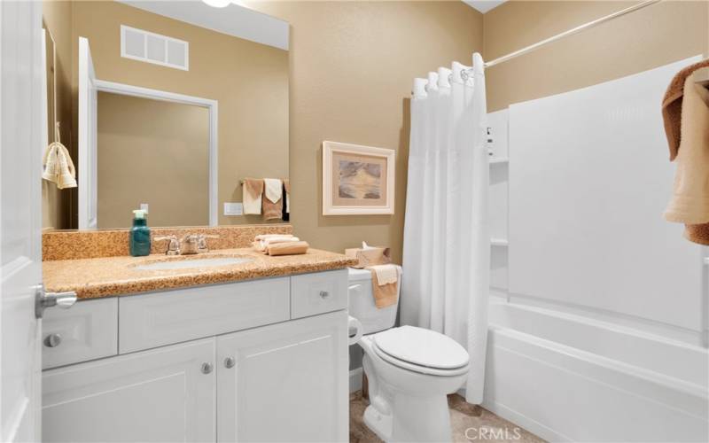 Hallway full bathroom with tub