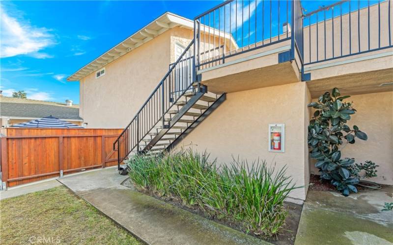 Stairway view to unit situated on upper level