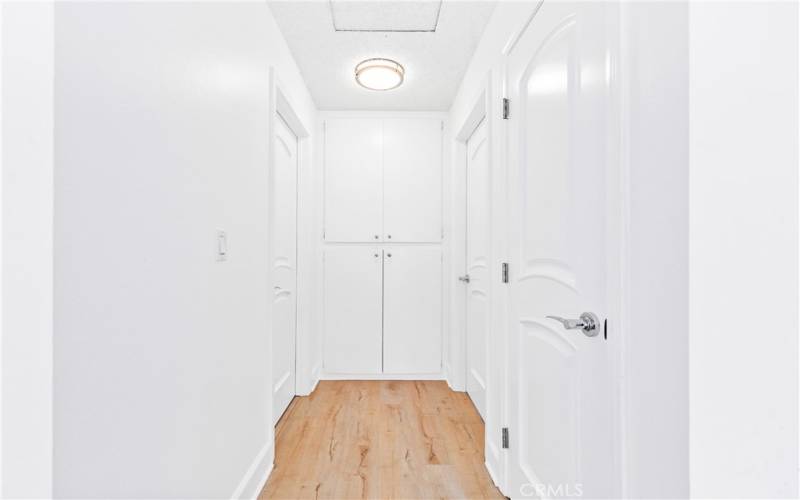 Hallway w/closet storage & cabinet storage