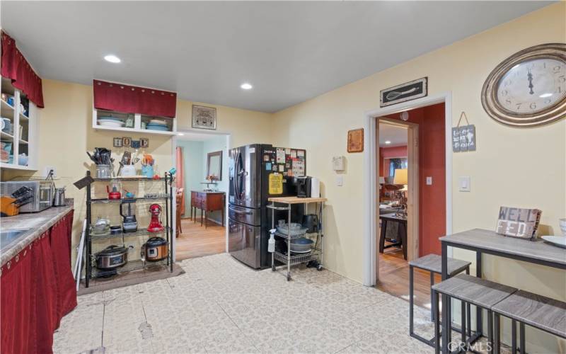 Kitchen with dining room in the background