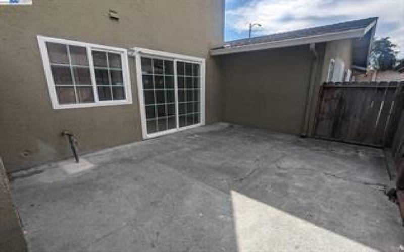 Back Patio, lock with key to access unit through back gate and parking spots