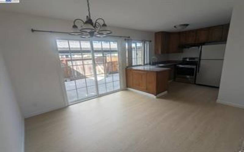 Ear in area. next to the kitchen and kitchen with granite counter tops