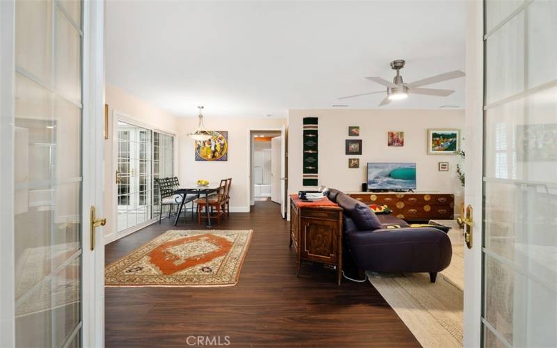 French doors welcome you into the living room from patio room.