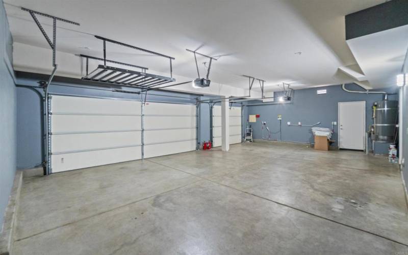 Beautiful over-sized side-by-side 3-Car Garage - plenty of parking space and storage