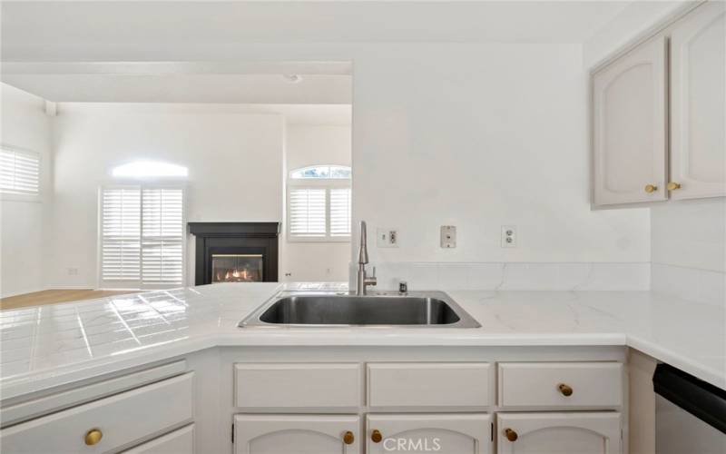 Sleek Epoxy Countertops Meet Warm Cabinetry