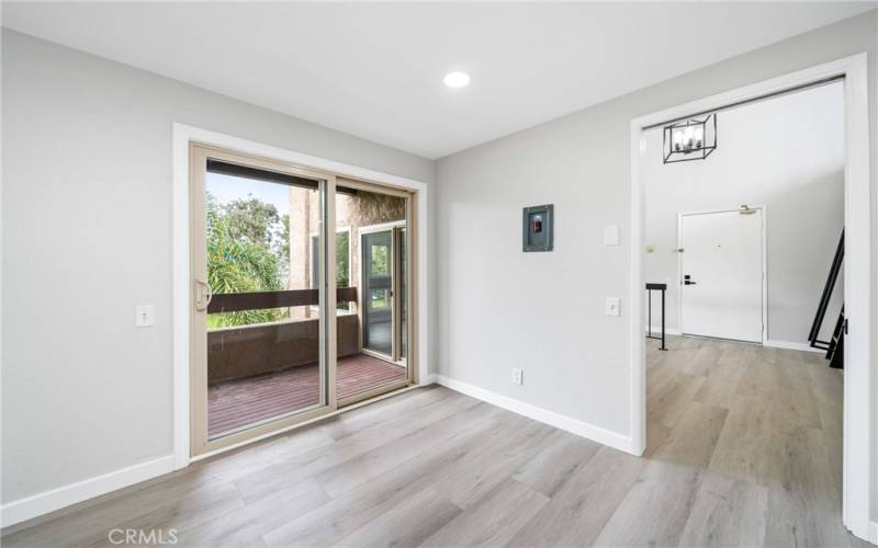 Off the kitchen and dining area there are glass sliding doors to a private balcony!
