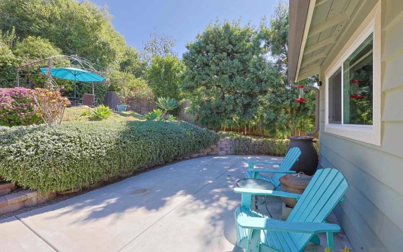 backyard lower area with a canopy shade