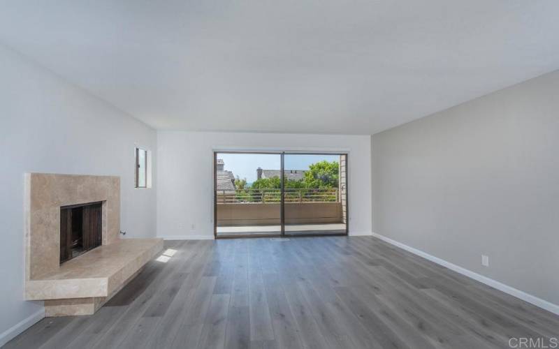 SPACIOUS LIVING ROOM W/FIREPLACE & DECK