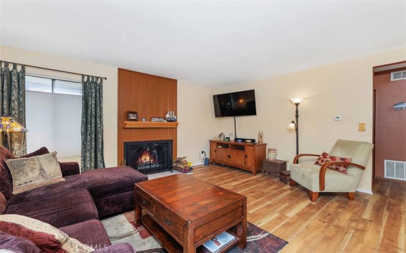 Living room w/ wood fireplace