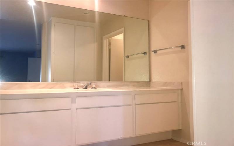 Primary suite bath with recessed lighting and plenty of counter and cabinetry