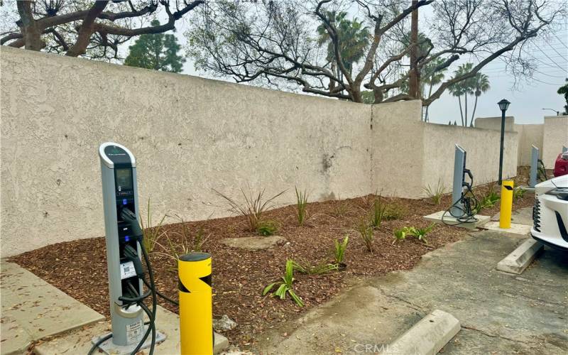 Newly installed car chargers (pay) located next to garage