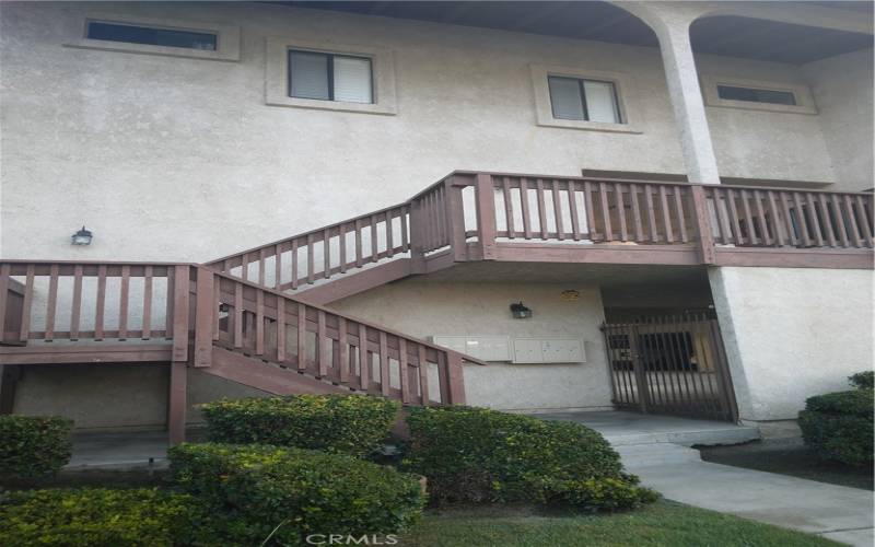 Walnut St stairs up to common area balcony