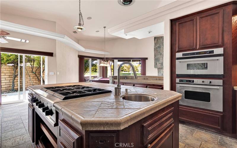 Kitchen Island has Drink/Wine Fridge, Cooktop and 2nd Sink with plenty of storage