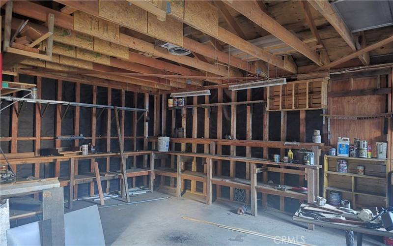 Inside Garage/Shop w/woodstove pipe in ceiling
