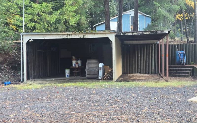 Carport with storage room at back