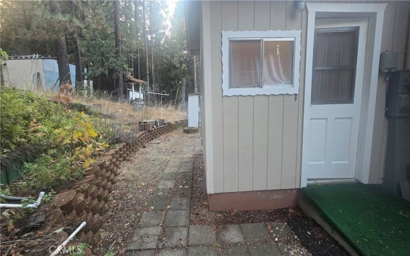 door to laundry room & path to back yard