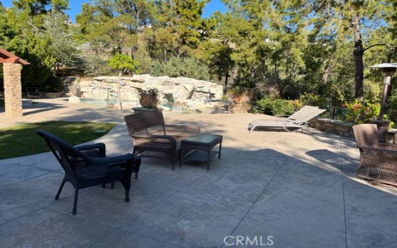 backyard relax area like beach between swimming pool and BBQ