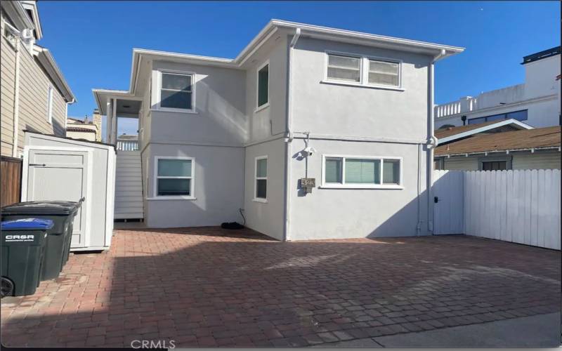 designated parking spot near locked side-yard storage