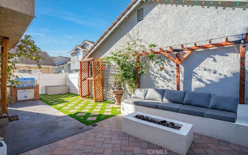 Private patio with built in seating and fire pit