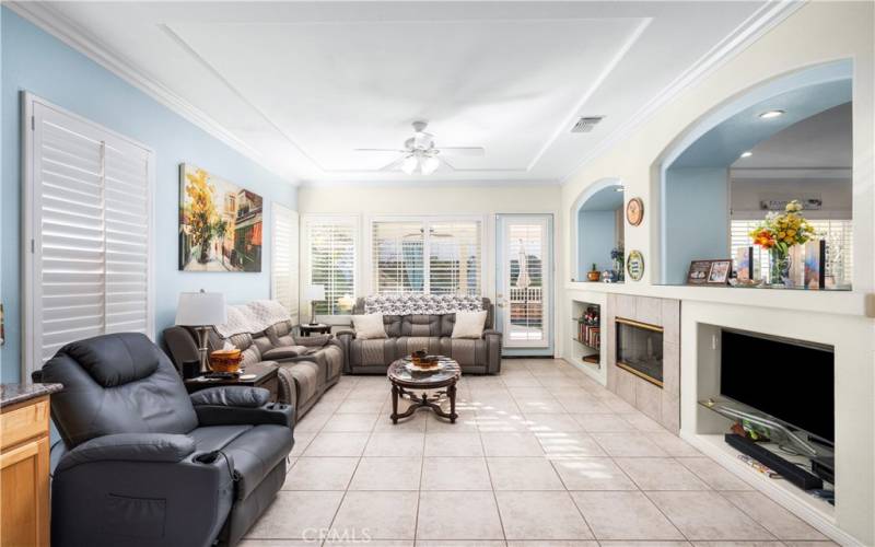 Family Room with Fireplace and Door leading to Back Yard