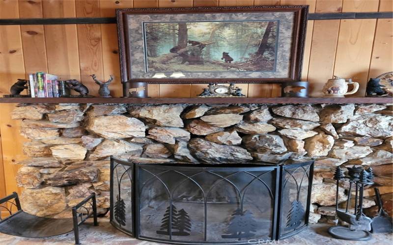 Stone, wood burning fireplace.