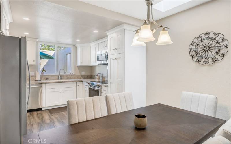 Kitchen opens to dining area