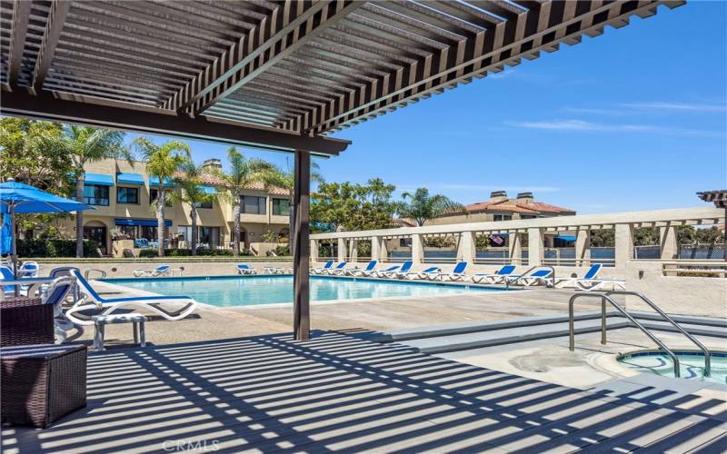 POOL VIEW TO LOUNGE CHAIRS AND PATIO COVER