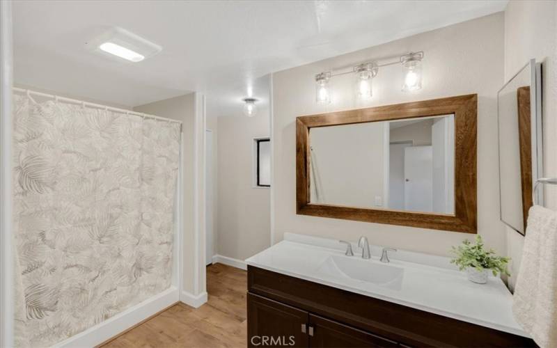 Master bath. Toilet has its own space behind the wall.