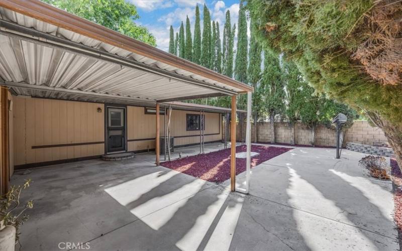 Large low maintenance backyard with large covered patio.