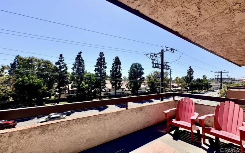 Great room balcony facing treelined street