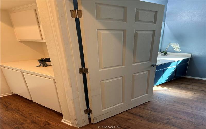 Hallway now has wood laminate. The second bathroom also just received waterproof wood laminate. Hall cupboards are also in this picture.