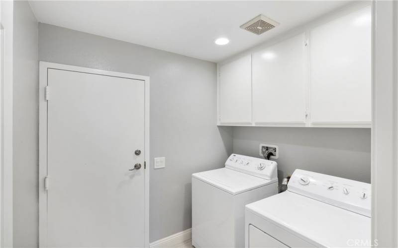 Laundry room has plenty of storage and direct garage access. Washer & Dryer included.