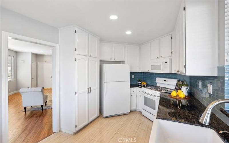 Functional kitchen offers plenty of cabinet space and comes with the refrigerator.