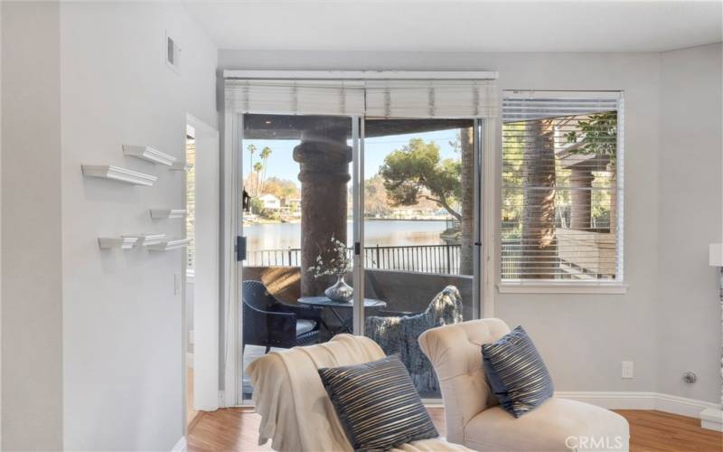 Covered patio off the living room offers peaceful relaxation with lake views.