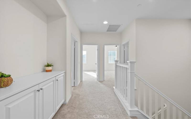 Upstairs landing to the two bedrooms, linen closet and hallway bathroom