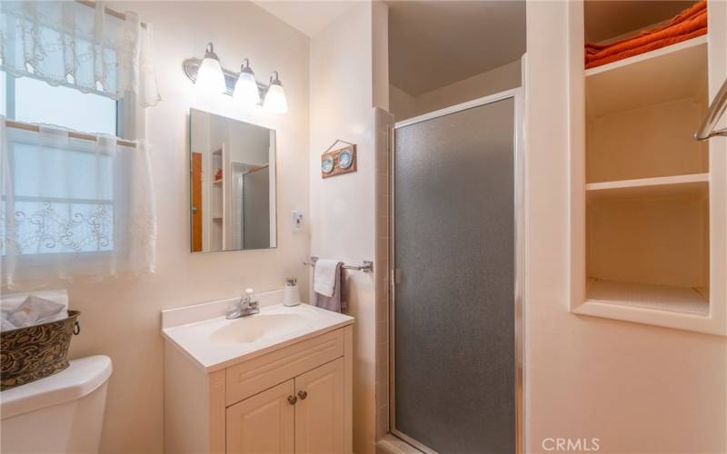 3/4 bath has a good sized shower and built in storage