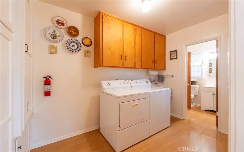 Laundry room that is attached to 3/4 bath. Lots of storage and cabinets