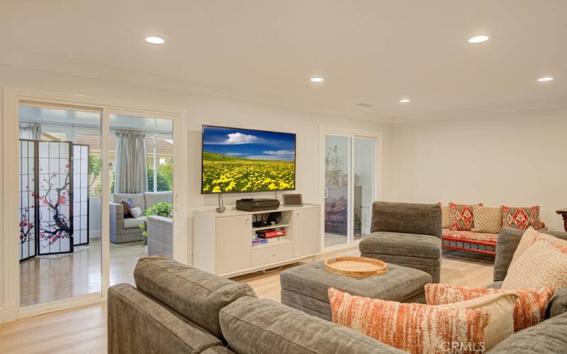 Another view of the living room. Glass sliders open to the bonus room.