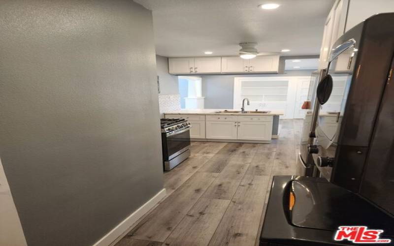 VIEW OF KITCHEN FROM SECOND BEDROOM