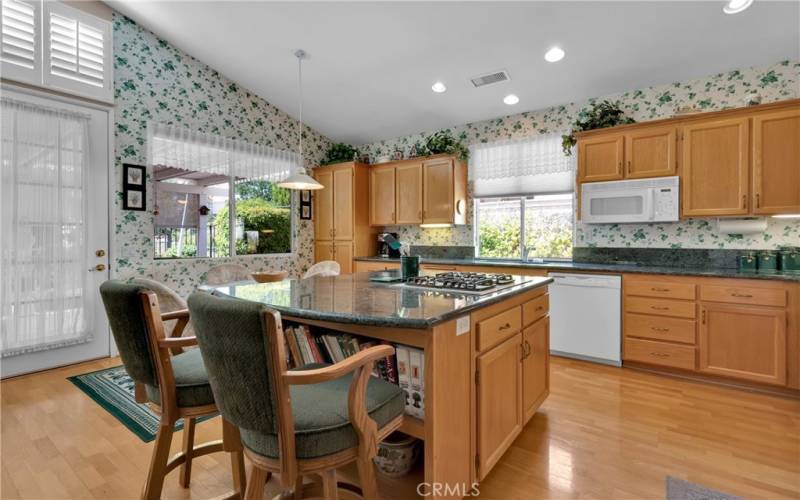 Kitchen with countertop cook stove.