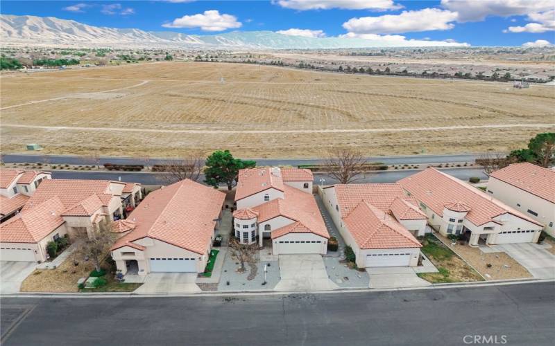 Center home with rocks in yard