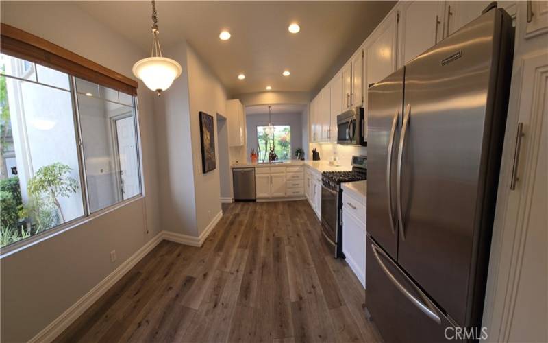 Large Kitchen: Luxury, recently upgraded, vinyl Newport floor, white quartz counters, painted cabinets, lighting fixtures