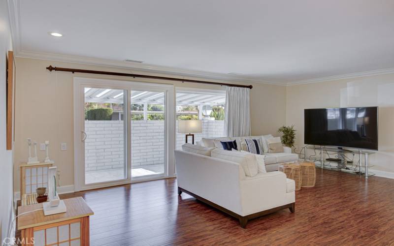 Gleaming wood floors - living room overlooks the spacious covered patio.