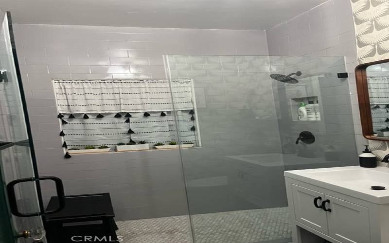 Amazingly upgraded Classic Subway Tile Shower and Terrazzo Tile Floors.