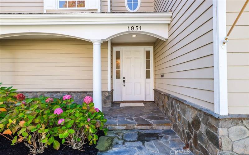 Inviting curb appeal with a front covered patio